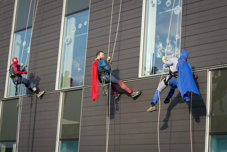 Superheroes abseiling at Royal Manchester Children's Hospital