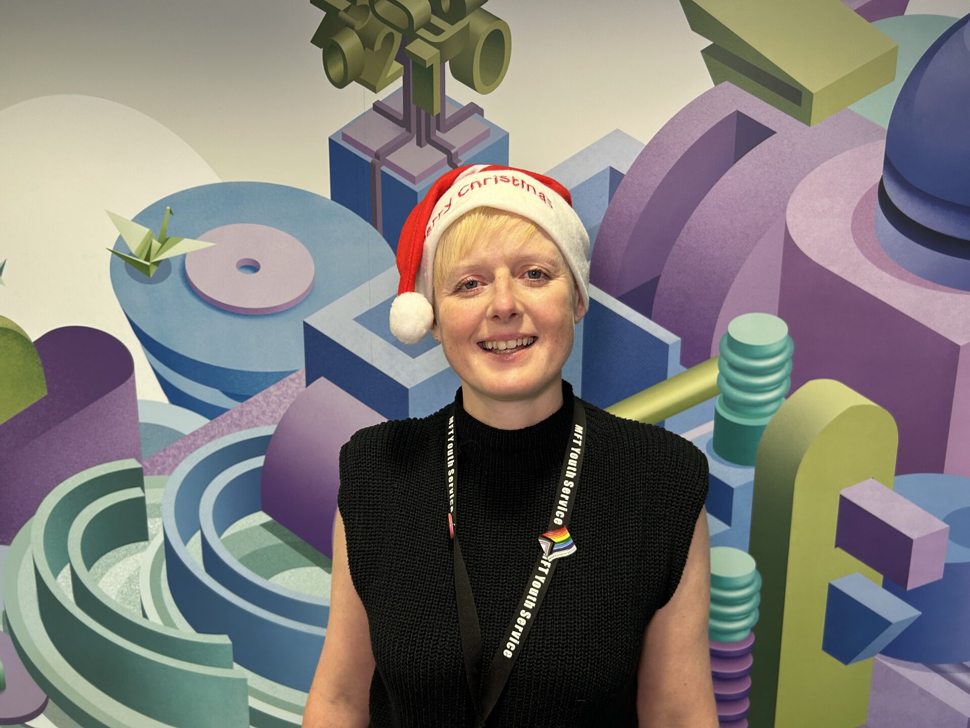 Christmas Appeal - Youth Service Manager Nic smiles in a Santa hat